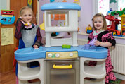 Girls Playing in Busy Bees Room
